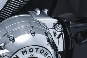 The Kuryakyn 5644 chrome rear oil panel accent designed for Indian models, surrounds the oil filler cap and converts the wrinkle black base of the motor