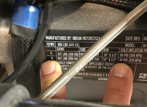 Check Your Tire Pressure One of the most common questions we see on forums and online in social media is "what tire pressure do I run?". The easiest way to confirm your pressure settings is to check the label on your motorcycle. The label shown here is from our 2016 Indian Scout. You can clearly see the "F" and "R" tire indications for front and rear, the tire size, wheel size and cold inflation setting. You can get better tire life and a better ride with this simple step!