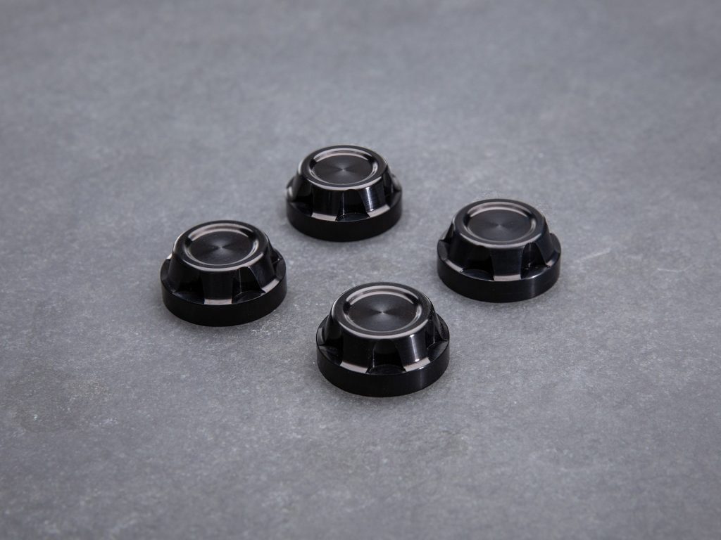 Shock mounting caps for lower and upper shock mount. This set include 4 beautiful caps, Crown design Easy to install onto the OE mounting hardware. All parts are CNC-machined and BLACKPearl anodized. 